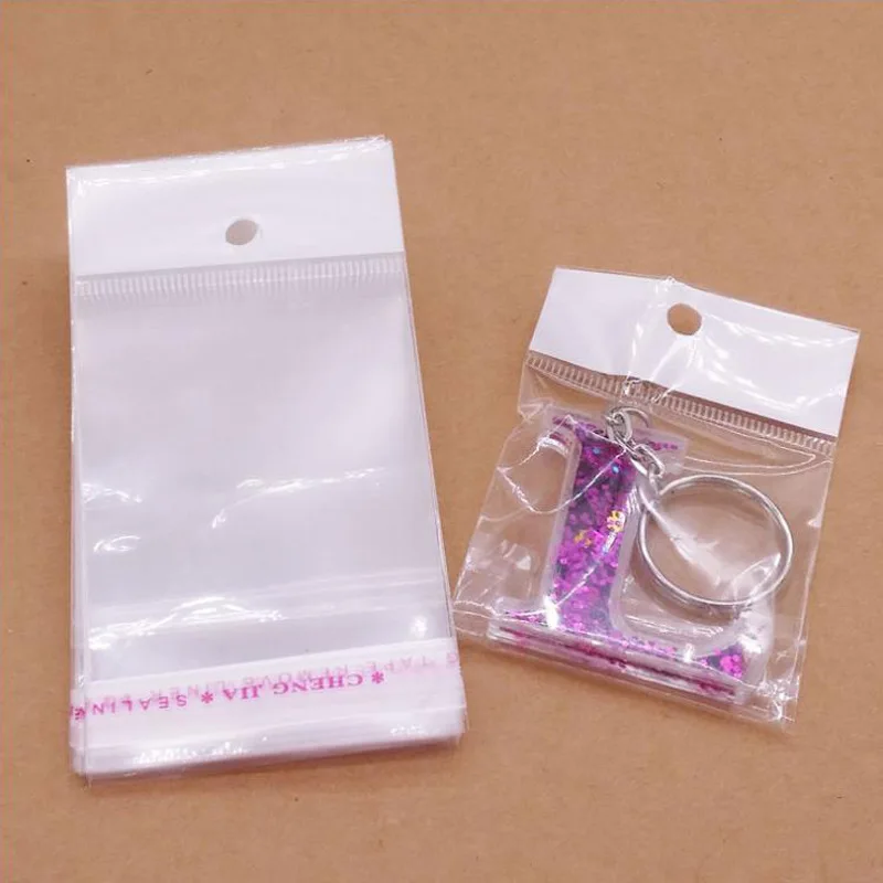 100pcs 투명 셀프 씰링 접착제 OPP 플라스틱 가방 쥬얼리 선물 포장에 대 한 교수형 구멍 소매 디스플레이 포장 가방
