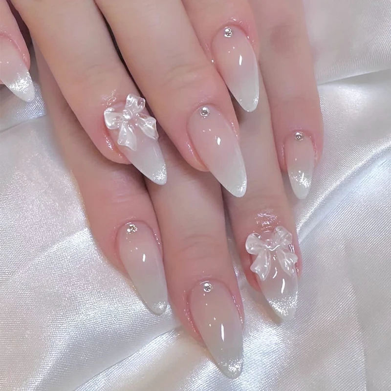 24pcs 달콤한 고양이 눈 손톱에 프렌치 프레스 다이아몬드 지적 3 차원 활 매듭 여성과 소녀를위한 착용 가능한 손톱 아몬드 네일 title=24pcs 달콤한 고양이 눈 손톱에 프렌치 프레스 다이아몬드 지적 3 차원 활 매듭 여성과 소녀를위한 착용 가능한 손톱 아몬드 네일 